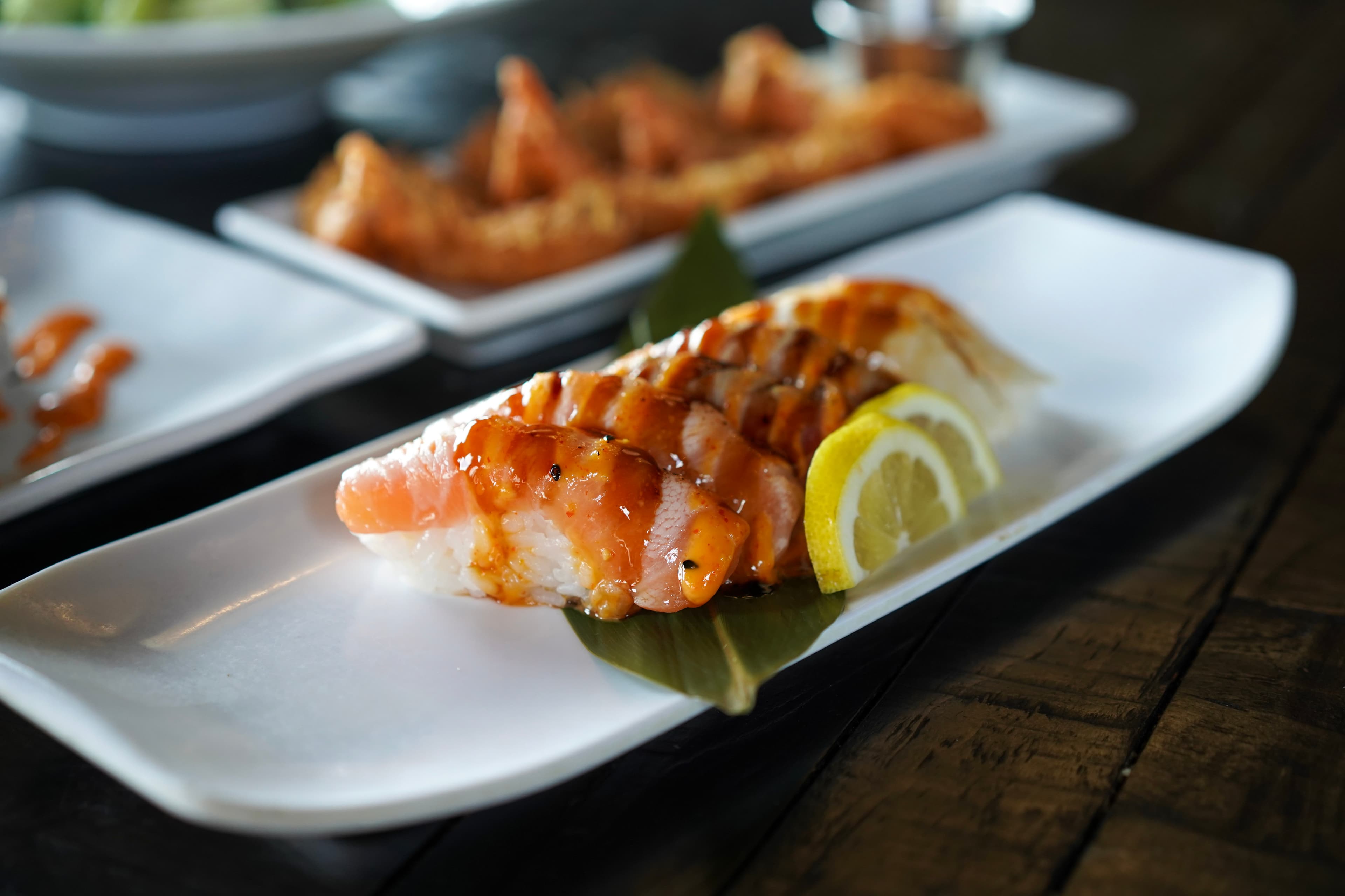 Premium nigiri sushi platter with salmon, tuna, and shrimp at Sparkly