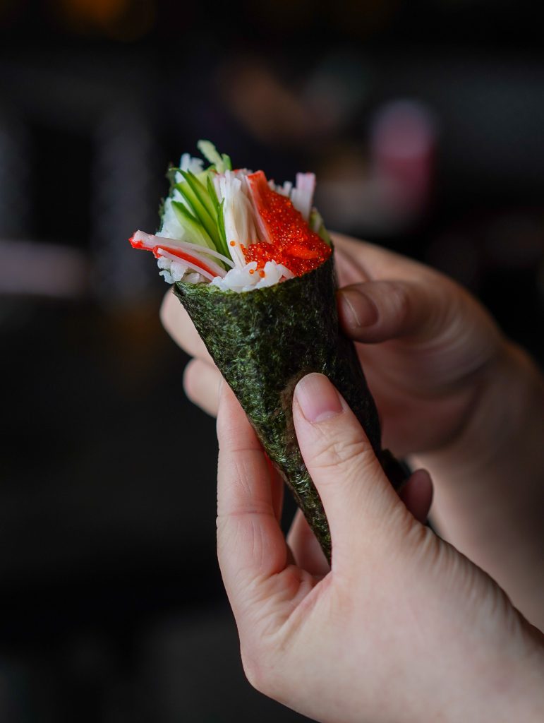 A Japanese Hand Roll being held at Sparkly Japanese & Thai Restaurant in Woodbridge, Ontario